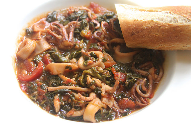 Calamari Braised with White Wine, Tomatoes & Spinach